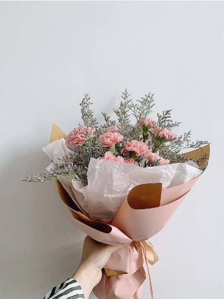 Studio arranging wedding bouquet